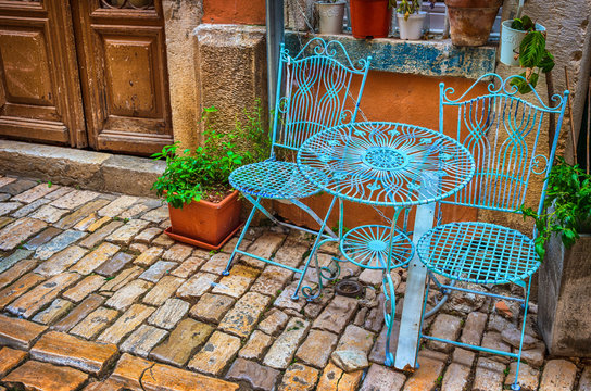 Chairs and table in the street.Garden furniture of a street coffee restaurant in old town of Rovinj, Istria, Croatia, Adriatic coast