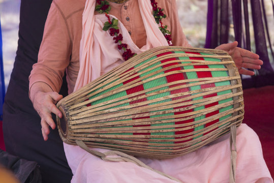 Hindu with a drum performs a cult rite. Religion