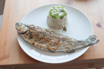 fish on plate served with rice