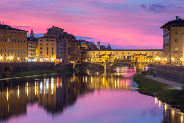 River Arno and famous bridge Ponte Vecchio at gorgeous sunset in Florence, Tuscany, Italy