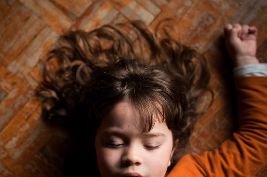 portrait of a girl laying on the floor