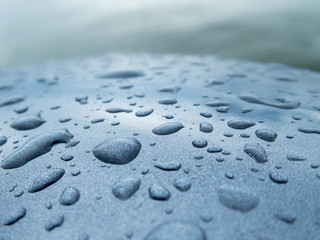 Droplets on curved metal paint