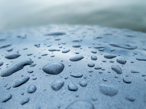 Droplets on curved metal paint