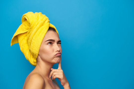 Woman With A Towel On Her Head Lost In Thought