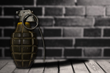 hand bomb on wooden floor with background wall