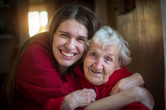 Portrait of Girl hugging her grandmother.