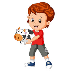 little boy holding cow bank