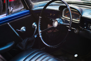 Black leather interior of a vintage car