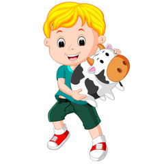 little boy holding cow bank