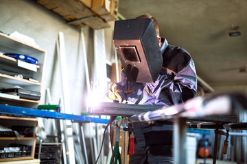 Welder working in workshop
