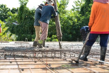 Civil worker fill concrete post tension slab in civil construction site