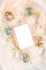 Mock up card. Christmas glass transparent ball with colorful sparkle confetti and decoration. Christmas concept