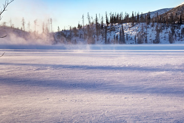Fototapeta premium Ice surface of the Stbske Pleso lake. Is a picturesque mountain lake of glacial origin and a top tourist destination in the High Tatras, Slovakia.