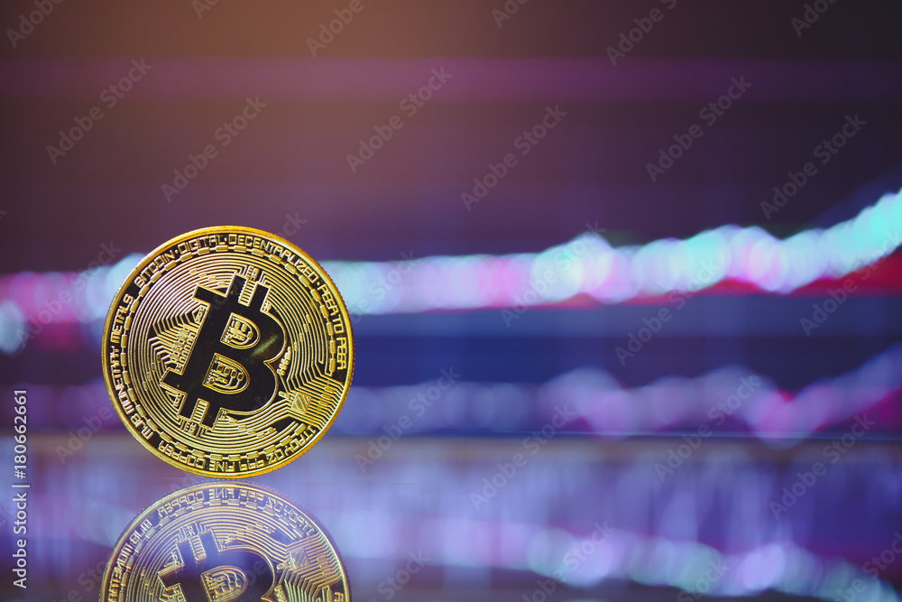 Poster bitcoin is a gold coin and a defocused graphics background. on the graph growth. the concept of virt