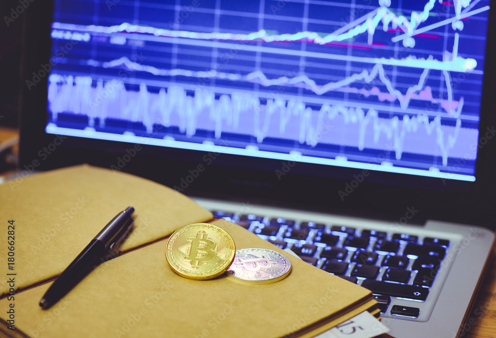 Fototapete bitcoin is a gold coin in the notebook of a business man against a computer background and an increa