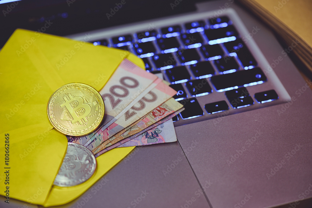 Poster bitcoin gold coin lies in an envelope with money on the background of the computer and the rising gr