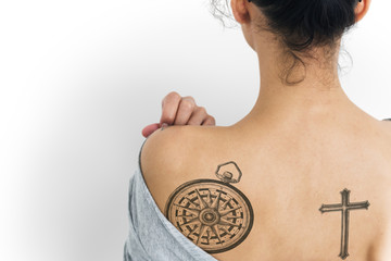 Back view portrait of a woman with a tattoo