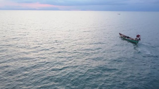 Fishing boat motoring in the Sea of Siam towards Vietnam.