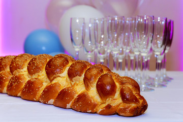 challah bread with sesame seeds , selective focus