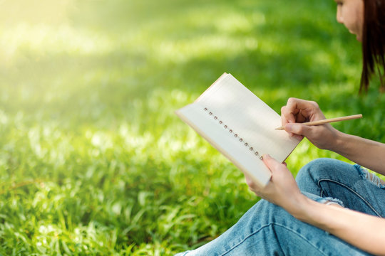 Cute Woman Reading Writing A Note Book At Nature Backgrounds Park Garden Yard Outdoors