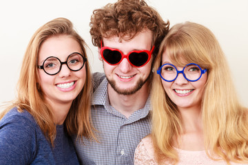 Happy friends man and women in glasses.