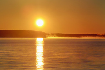 Morning, sunrise, mist on the river, the path from the sun.