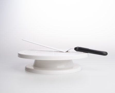 cake stand with cake spatula on a background.