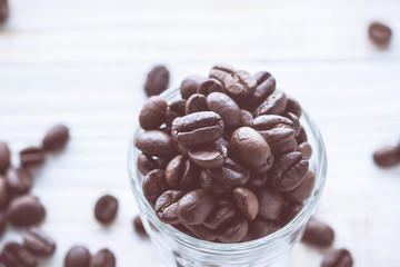 Top view of coffee beans with glass shot. vintage color effected