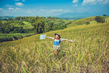 Asian women travel relax in the holiday. Expand survey map Mountain field. crop rices Ranch on hill. Thailand