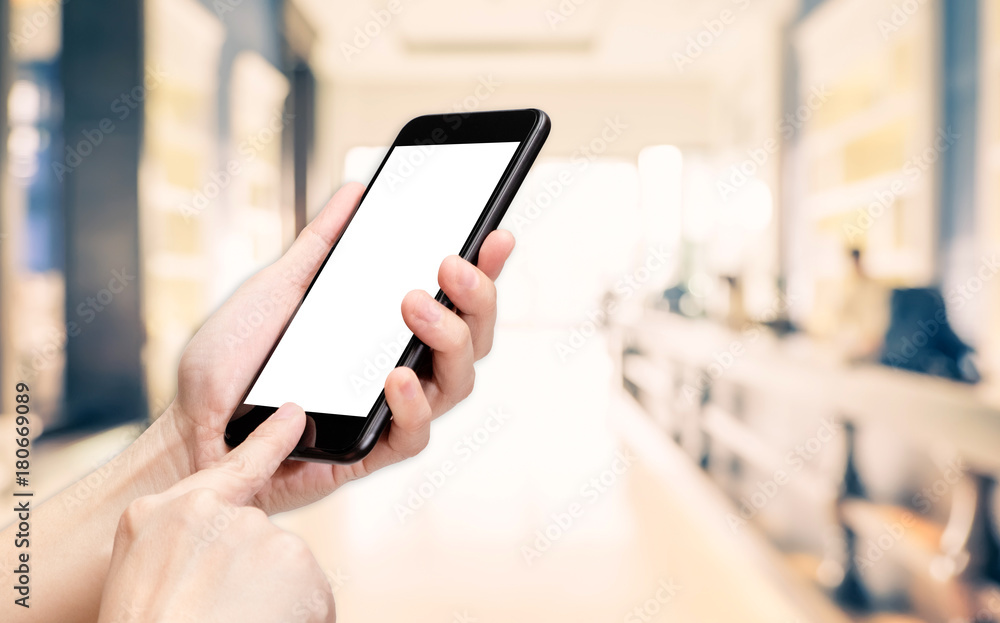 Poster Hand click mobile phone with blur office corridor hall way background bokeh light,White screen mock up template for adding your design or your text