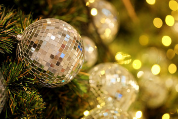 Fototapeta na wymiar close up mirror ball or Christmas ball to decorative for Christmas festival with bokeh background. Have some space for write wording