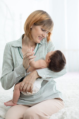 Portrait of happy mother and baby