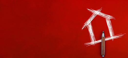 drawing of white house sketch on red leather background with free copyspace for your text