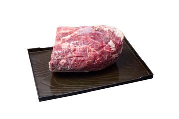 raw eye of loin on a black plate with chops