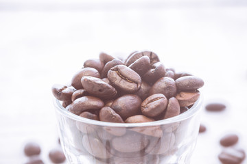 Top view of coffee beans with glass shot. vintage color effected