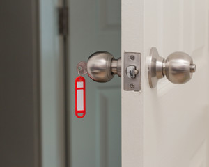 Red key tag with opened door