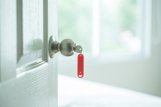 Red key tag with opened door