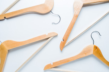 Wooden hanger on white background