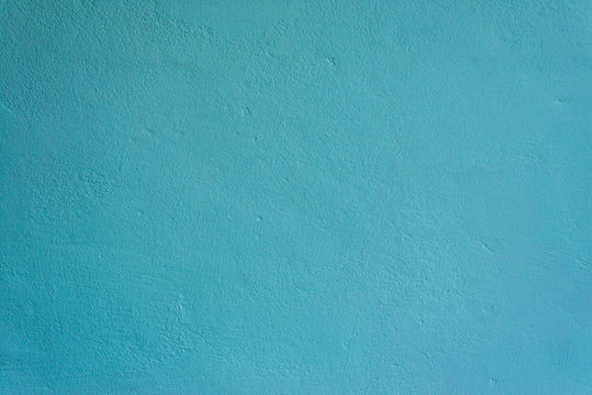 texture of a painted turquoise concrete wall