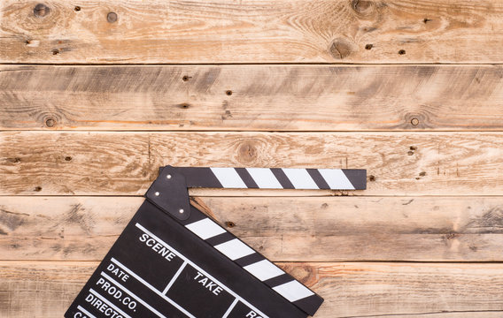 clapperboard on wood background
