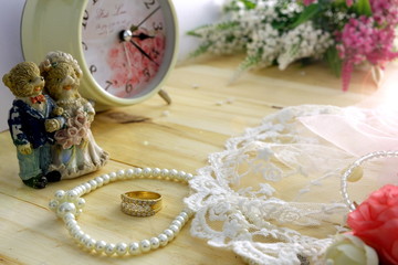 Marry theme in vintage style on wood desk with pearls necklace ,ring