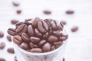 Top view of coffee beans with glass shot. vintage color effected