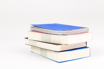 A stack of books on a white background.