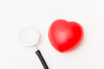 Red heart and a stethoscope. Isolated on white background. Studio lighting. Concept for healthy and medical