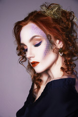 young red hair woman with colorful make-up