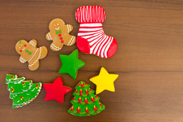 Festive tasty Christmas cookies on wooden table. Top view