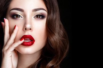 Fashion woman portrait on black background with red shiny lips. - 180680633