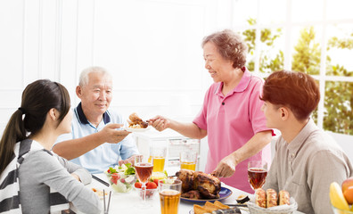 Happy asian family having dinner together