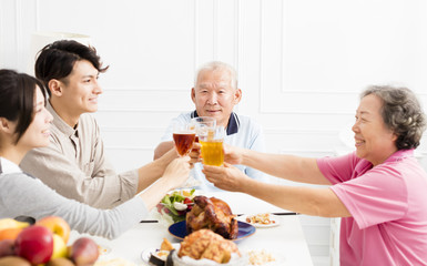 Happy family having dinner together.