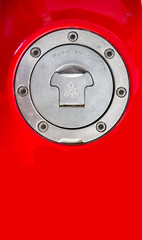 Motorcycle Aluminum Fuel Tank Gas Cap Door Cover on red background